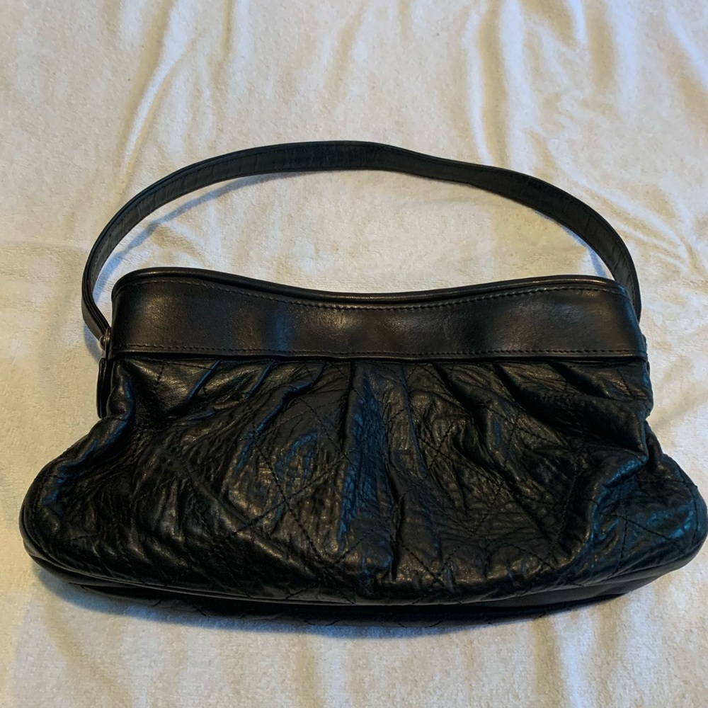 Black Chanel quilted bag. Sold as is and no inclusions.